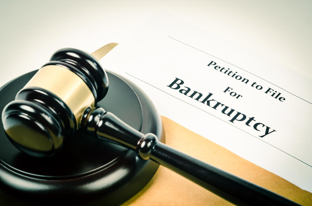 Image of gavel on document titled “Petition to File for Bankruptcy,” representing how southern WV bankruptcy lawyer Jason Harwood helps clients navigate how to improve their financial future through bankruptcy.