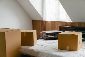 Image of a room with moving boxes and suitcases, representing how Jason Harwood helps protect your interests in WV marital property division and other issues raised in divorce.