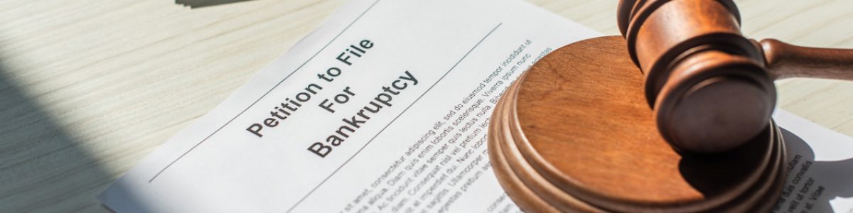 Image of gavel laying on top of a Petition to File for Bankruptcy file, representing how Harwood Legal, PLLC can help debtors file for bankruptcy in WV.