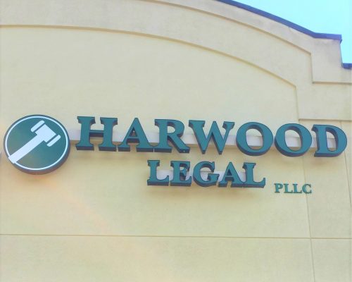 Outside image of the Harwood Legal storefront, representing the office a client can come to when looking for an experienced, compassionate, skilled hometown attorney in Southern WV.