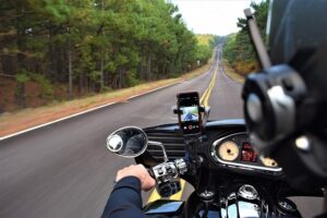 Image of a biker driving on a mountainous highway, representing the need for a southern WV motorcycle injury lawyer when a motorcycle accident happens in the mountains of WV.
