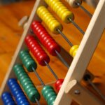 Image of an abacus, representing law changes that may prompt a West Virginia child support modification.